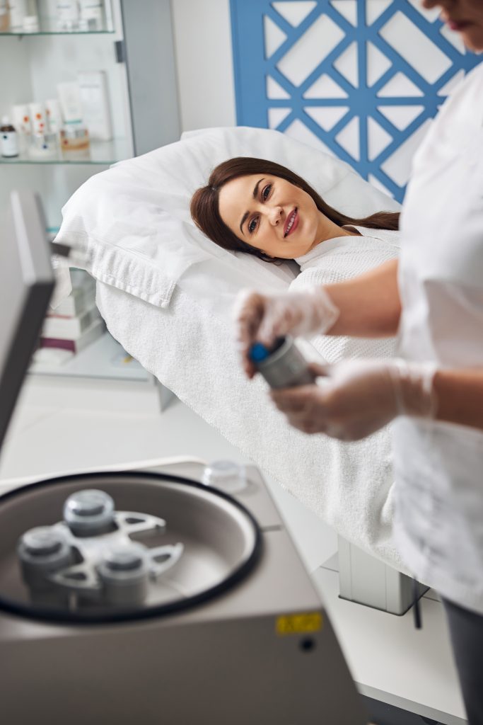 charming woman lying on daybed in cosmetology clinic